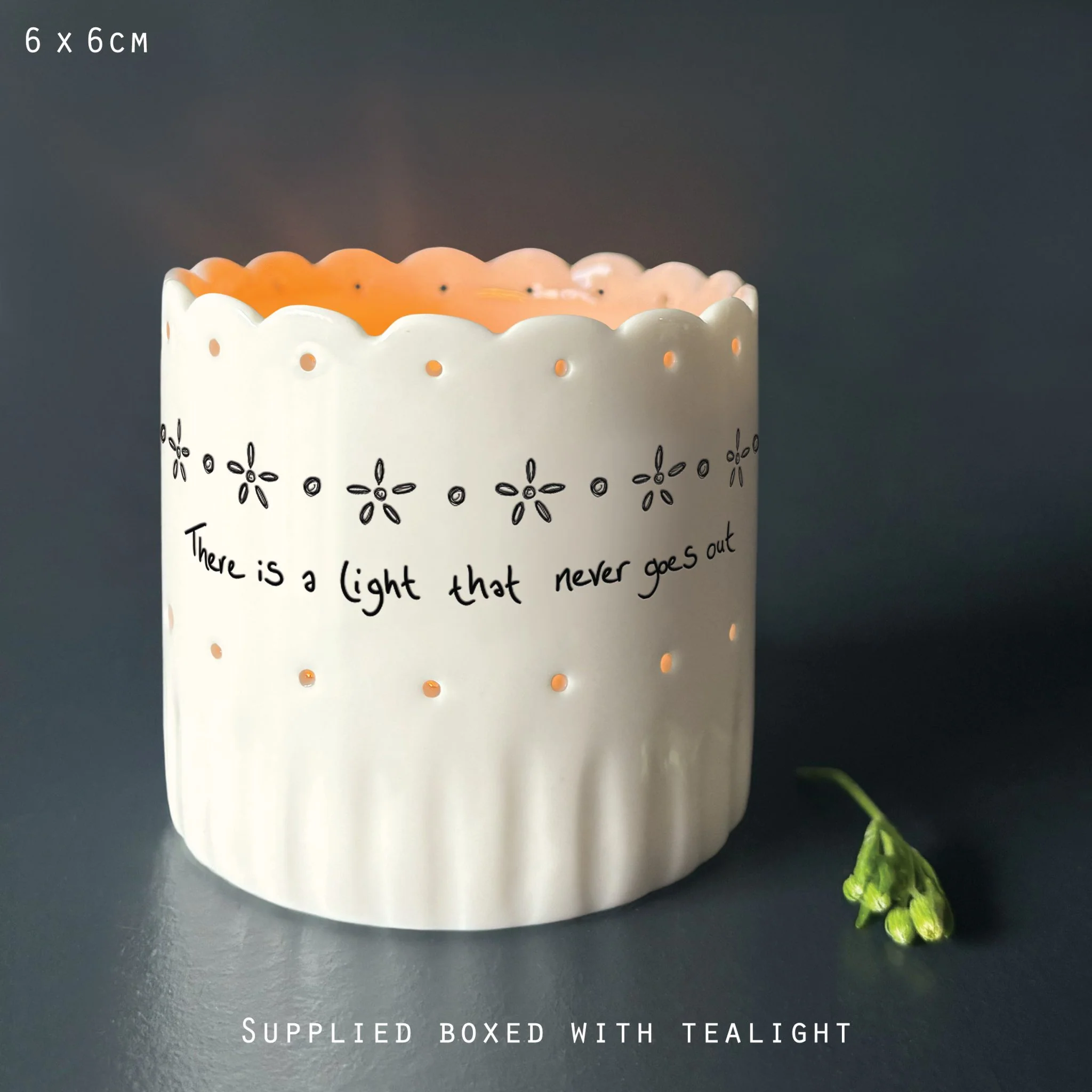 East of India Scallop Tea Light Holder-There is a light
